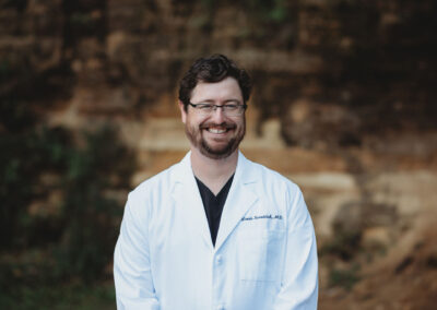 Headshot of Dr. Louis Scrattish, Chief Medical Director of Badger State Hydrate